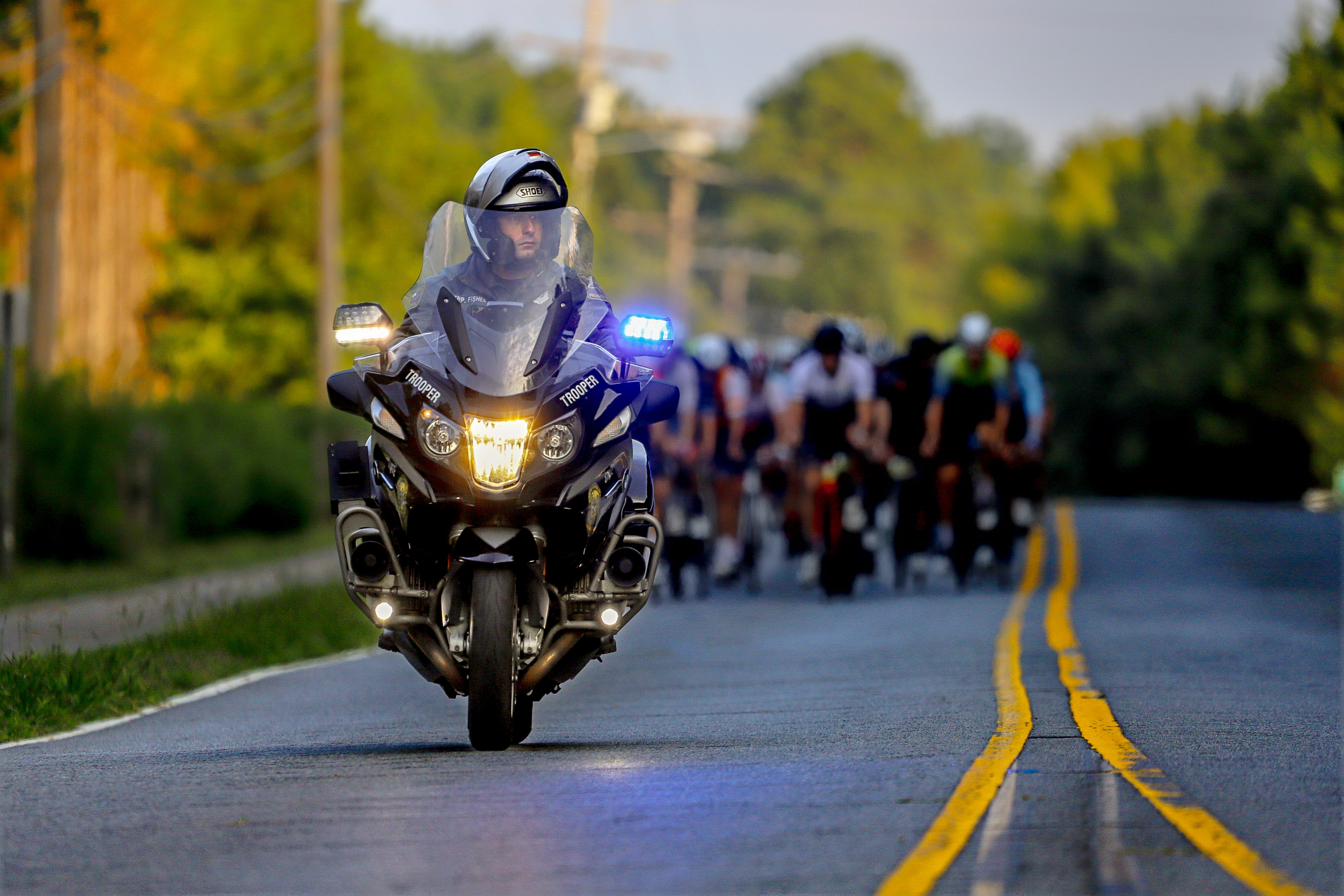 State trooper escorting 550+ riders through Lake Norman at dawn